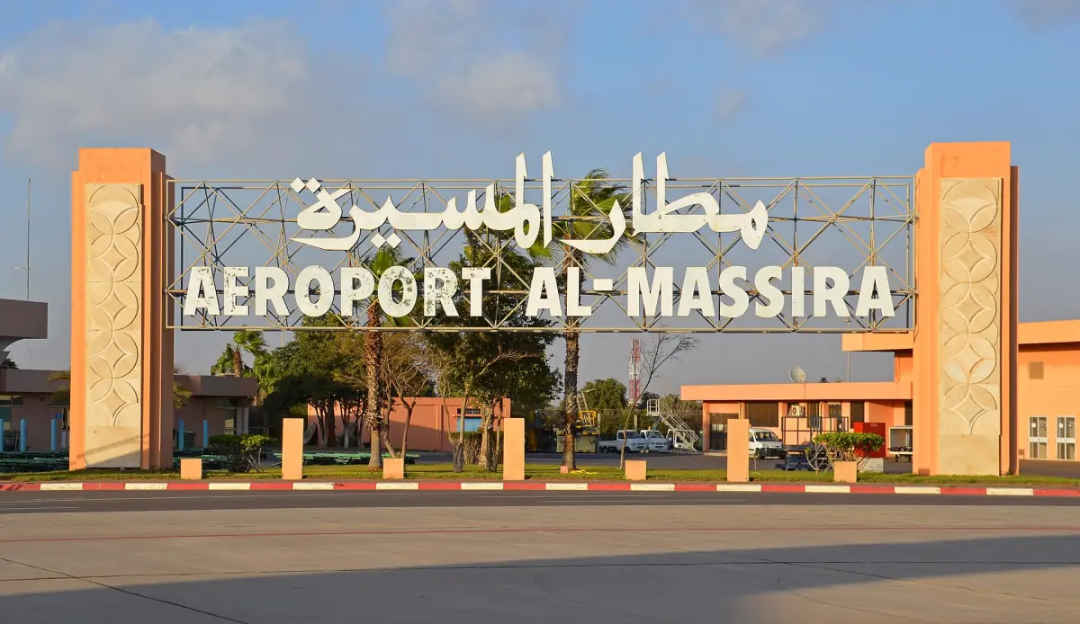 Arched entrance sign of Agadir Al Massira airport with Arabic and Latin lettering
